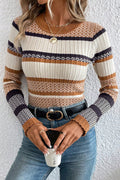 Person wearing a striped sweater with a white background
