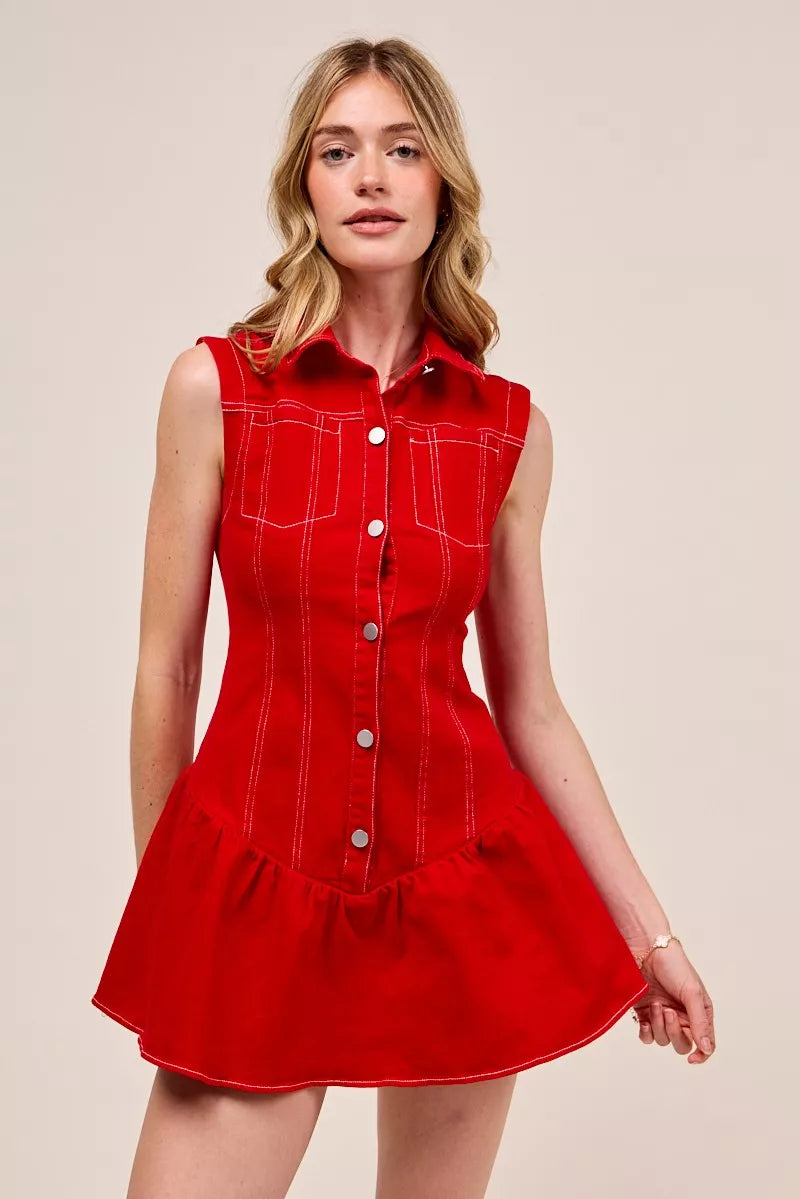 Woman wearing a red dress with white buttons- DEA Collections