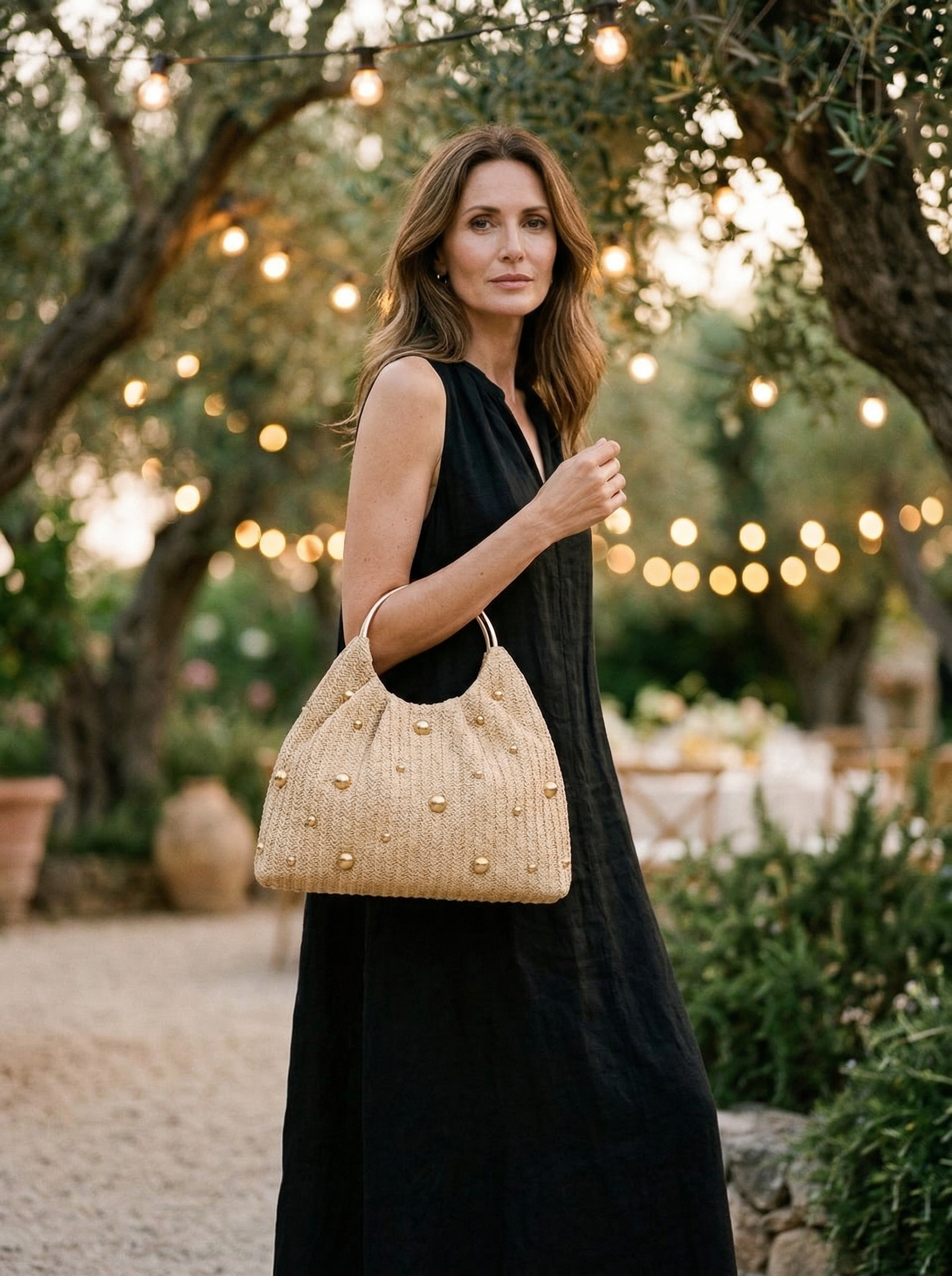 Artisanal Studded Handwoven Raffia Bag with Sculptural Gold Ring Handle - DEA collection