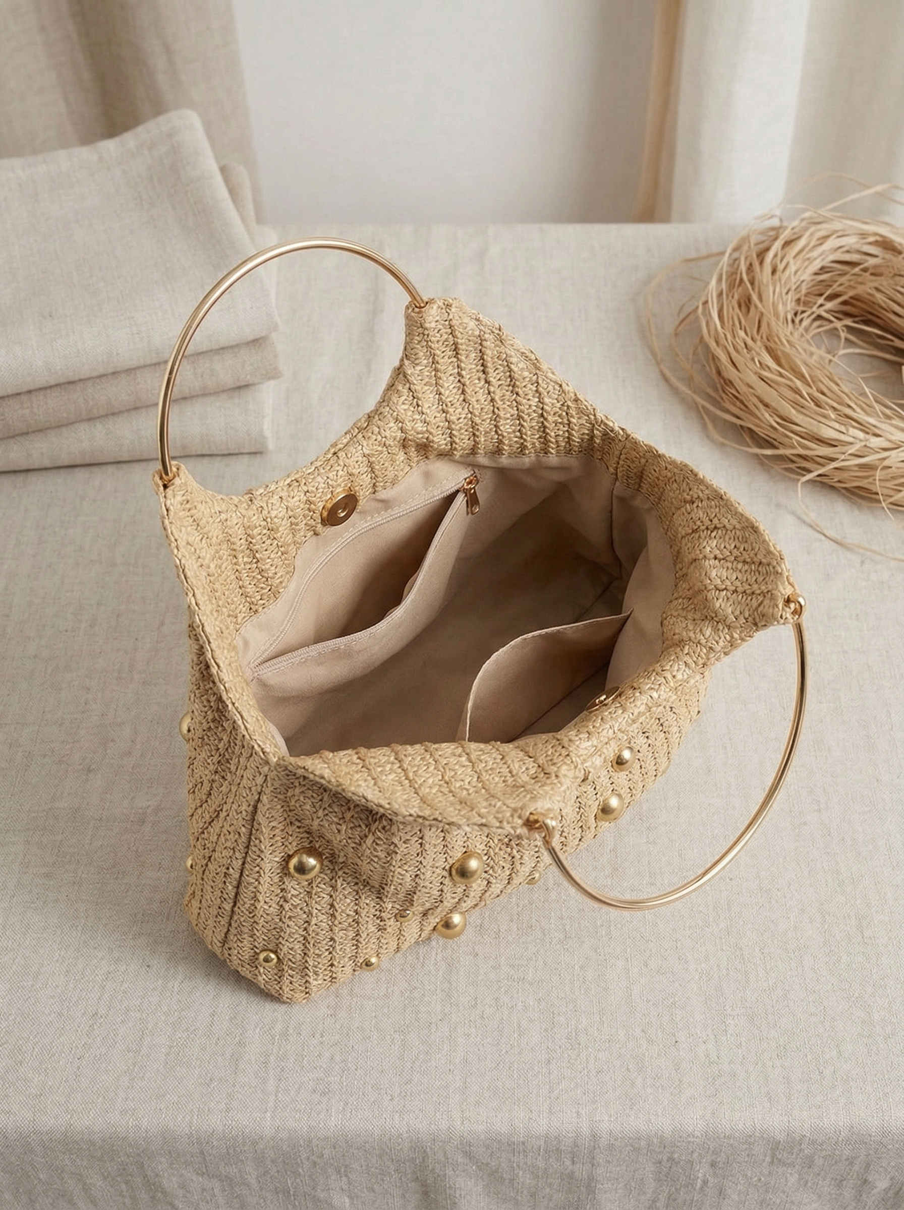 Artisanal Studded Handwoven Raffia Bag with Sculptural Gold Ring Handle - DEA collection
